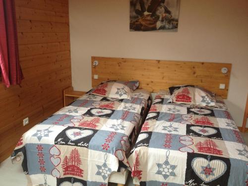 Ένα ή περισσότερα κρεβάτια σε δωμάτιο στο Chalet Anould