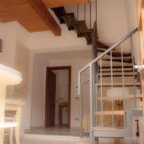 a staircase in a room with a stair case at Il Borgo Di Pegui in Bolano