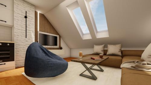 a living room with a couch and a table at Apart Hotel Gondola in Jahorina