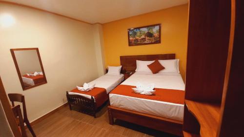 Postel nebo postele na pokoji v ubytování Hotel Yagua