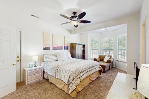 a bedroom with a bed and a ceiling fan at Shoreline Haven in Kimberling City