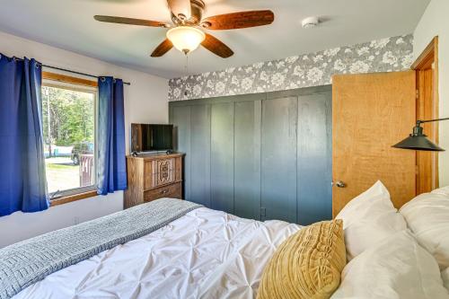 a bedroom with a bed and a ceiling fan at 4 Mi to Lake Michigan Updated Benton Harbor Home! in Benton Harbor