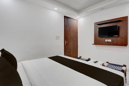 TV a/nebo společenská místnost v ubytování Hotel O Dada Hotel& Restaurant