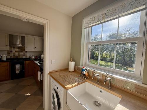 a kitchen with a sink and a window at 2 bed in Whitland 43978 in Whitland