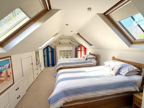 two beds in a attic room with skylights at 2 bed in Whitland 43978 in Whitland