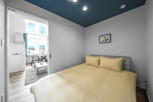 En eller flere senge i et værelse på FURANO RESORT WAKABA E - Vacation STAY 20176