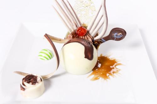 a group of pendants with chocolate and other items at Pickalbatros Aqua Blu Sharm El Sheikh in Sharm El Sheikh