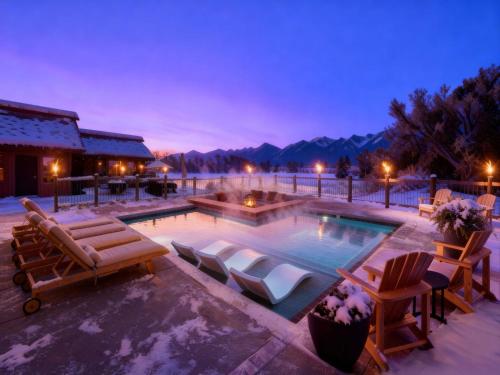 a swimming pool with lounge chairs and a resort at Big Medicine Cabins in Saint Ignatius
