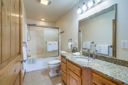 a bathroom with a toilet and a sink and a mirror at Groups Welcome! Ocean-View Escape in Gold Beach in Gold Beach