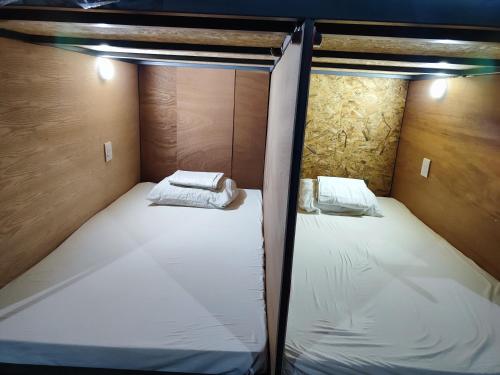 Postel nebo postele na pokoji v ubytování Hotel Capsula SANTO DOMINGO