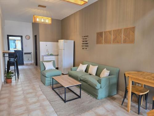 a living room with a couch and a table at SIMPLE Inn in El Chalten