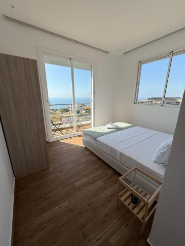 Una cama o camas en una habitación de La Ola