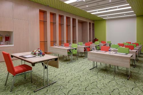 a room with tables and chairs in a building at Al Khoory Atrium in Dubai