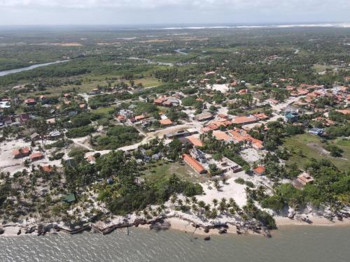 an aerial view of a small island in the water at chale vilana in Atins