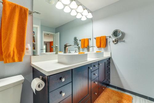 a bathroom with two sinks and a large mirror at New Braunfels Escape, Walk to Gruene Hall! in New Braunfels