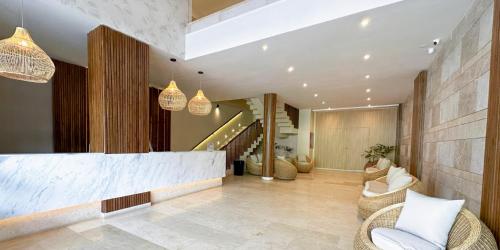 a lobby with chairs and a staircase in a house at Hotel Caribbean by On vacation in San Andrés