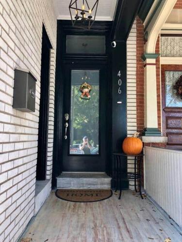 a black door with a picture of a person on it at THE STEVENS STUDIO - HISTORIC DOWNTOWN LANCASTER in Lancaster