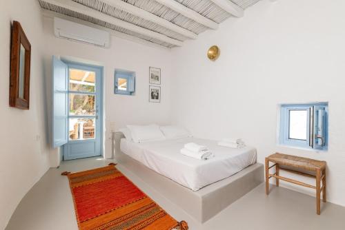 Postel nebo postele na pokoji v ubytování Traditional Mykonos Village House