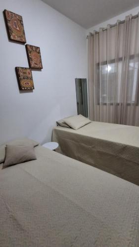 Ένα ή περισσότερα κρεβάτια σε δωμάτιο στο Santos & Oliveira