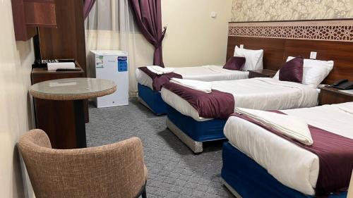 Katil atau katil-katil dalam bilik di Hayat Almansi Hotel