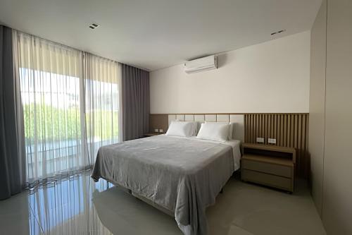 Postel nebo postele na pokoji v ubytování Modernidade e alto padrão em Cotia