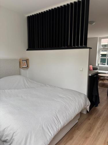 Ένα ή περισσότερα κρεβάτια σε δωμάτιο στο Studio Fnidsen