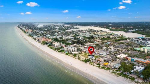 an aerial view of a beach with a speed limit sign at Luxury Family Beachfront Oasis Pool Spa and Views in Clearwater Beach