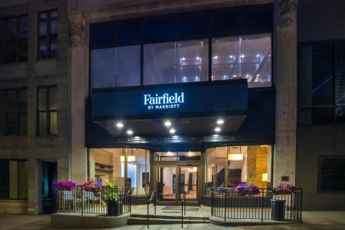 a building with a sign that reads f knitfield of marriott at Fairfield Inn & Suites by Marriott Albany Downtown in Albany