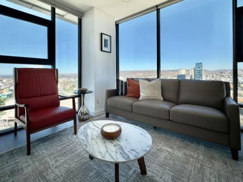 a living room with a couch and a chair at Cosmopolitan TJ - Costco and San Ysidro Border USA in Tijuana