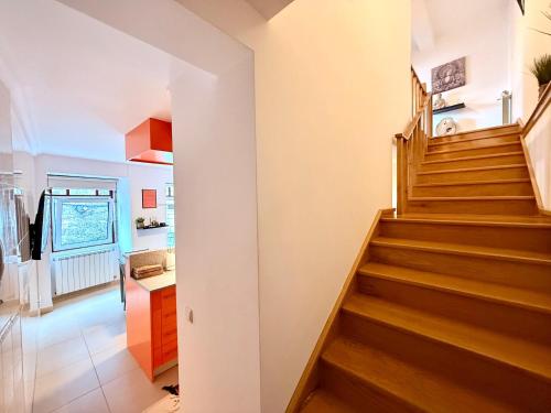 a hallway with a staircase in a house at Casa Dos Passos II in Guarda