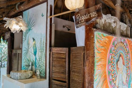 a room with a colorful painting on the wall at Cavelands become one with nature in Cedro
