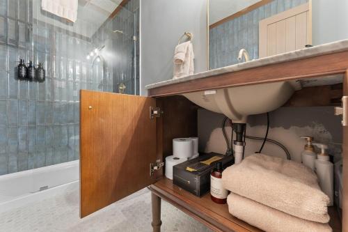 a bathroom with a sink and a shower at Charming Tahoe Cabin in Incline Village
