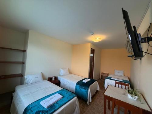 Hotel Parque Acuáticoにあるベッド