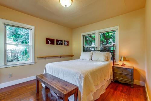 a bedroom with a bed and two windows at Extended Stay in Sacramento! Dog-Friendly Home in Oak Park