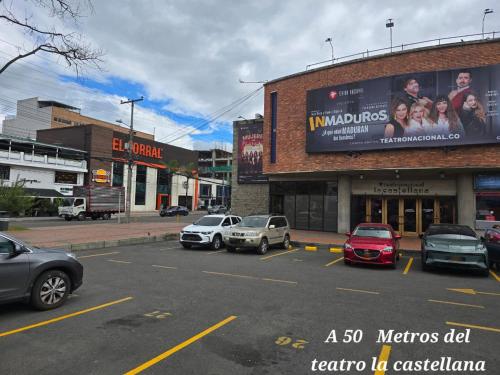 a city street with cars parked in a parking lot at Hotel Castellana 95 Bogota By Hoteles Confort 80 in Bogotá