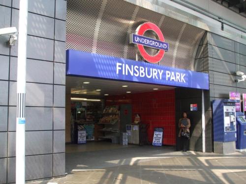 a entrance to a shopping mall with a sign on it at Finsbury Park Studio Apartments in London