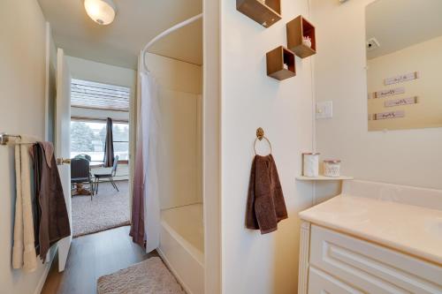 a small kitchen with a walk in closet and a hallway at Cozy Tawas City Home with Views of Lake Huron! in Tawas City