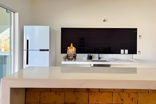 Η κουζίνα ή μικρή κουζίνα στο 3 quartos c/ área gourmet