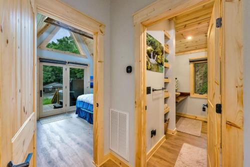 a small room with a bed and a window at High Peak At West Jefferson A Frame in West Jefferson