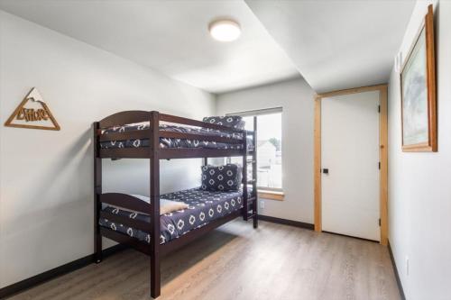 a bedroom with two bunk beds in a room at Lorene St Condo in Rexburg