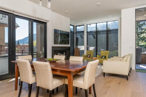 a dining room with a wooden table and chairs at The Lofts at 660 #201 in Ketchum