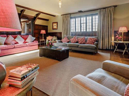 a living room with couches and a table at 4 Bed in Llanover 91243 in Abergavenny