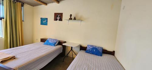 A bed or beds in a room at Pacasmayo Surf Las Torres