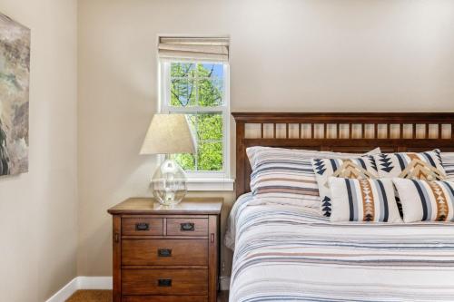 a bedroom with a bed and a window at Bitterroot Escape in Whitefish