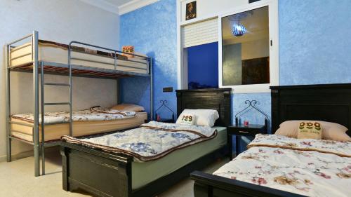 Ένα ή περισσότερα κρεβάτια σε δωμάτιο στο Tazrart tamraght