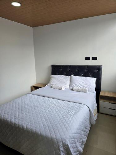 Postel nebo postele na pokoji v ubytování Hotel Penthouse Terraza cerca Cardio Infantil