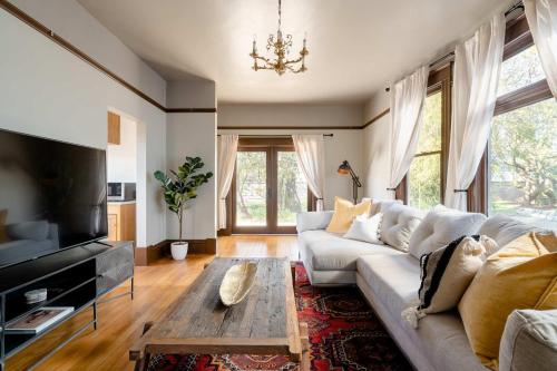 a living room with a couch and a coffee table at 2BR Historic Soul District Remodel in Portland