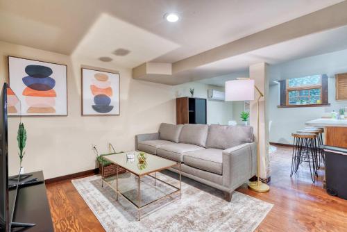 a living room with a couch and a table at Stay Portland - 1BR Historic Soul District Remodel in Portland
