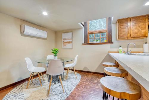 a kitchen with a table and chairs and a sink at Stay Portland - 1BR Historic Soul District Remodel in Portland