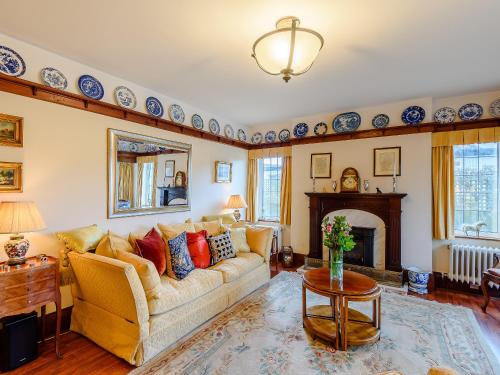 a living room with a couch and a fireplace at Brandon in Sutton on Sea